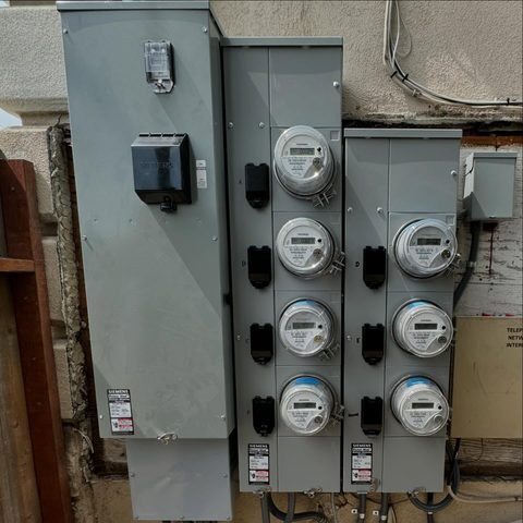New multi-meter bank with eight meters on a grey wall
