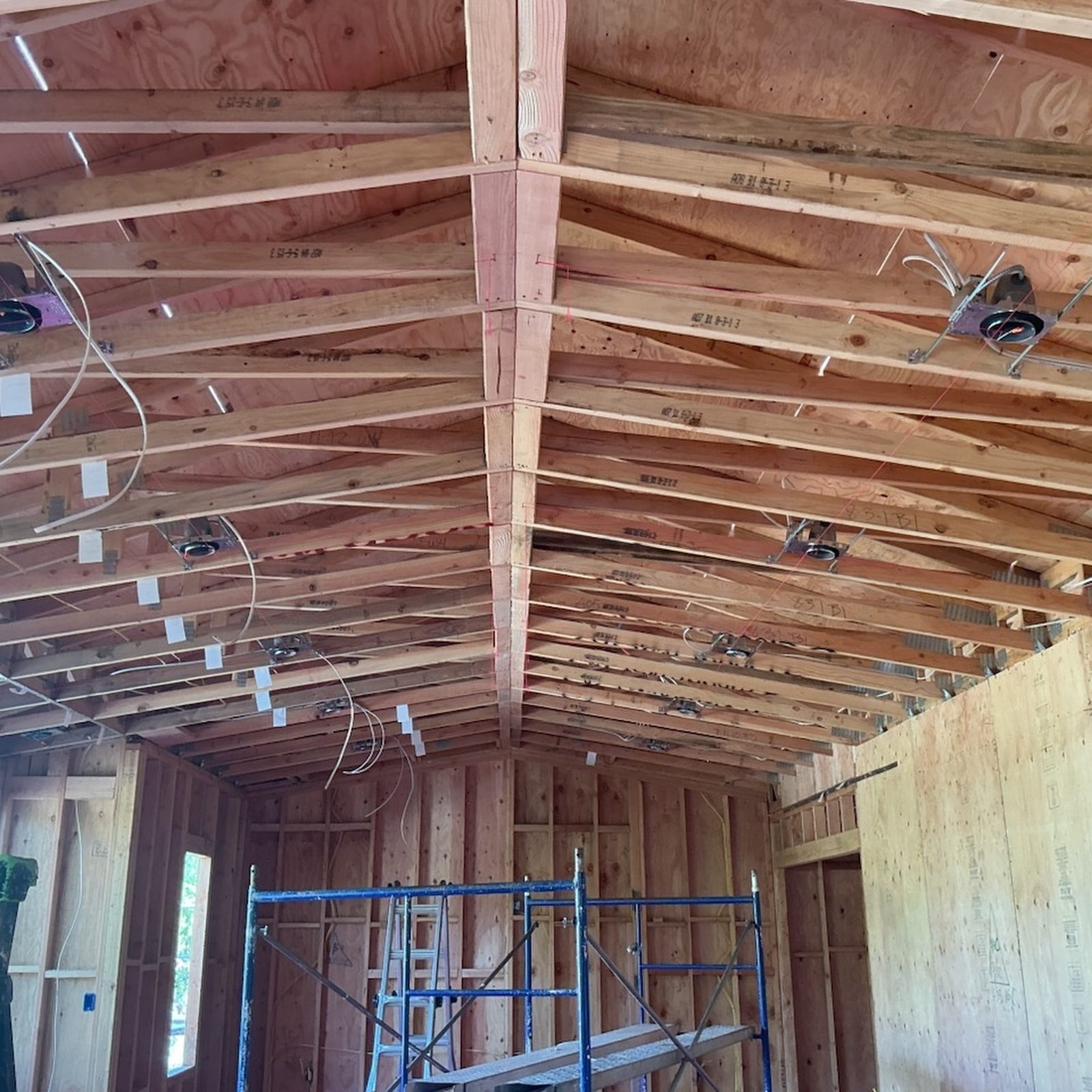 Vaulted-ceiling electrical rough-in with can-light rings and scaffold